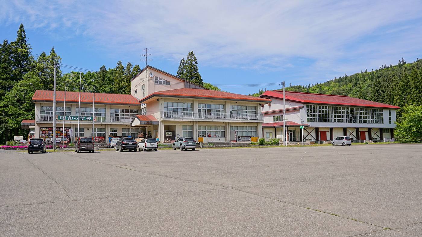 The former school building that houses Yama no Eki Showa School, seen across its forecourt.